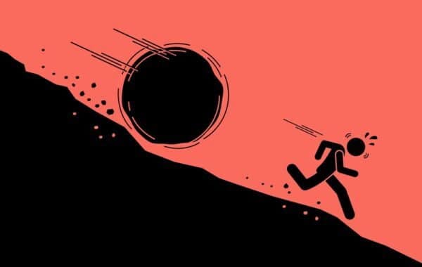 boulder rolling downhill towards figure running away frantically - cartoon drawing
