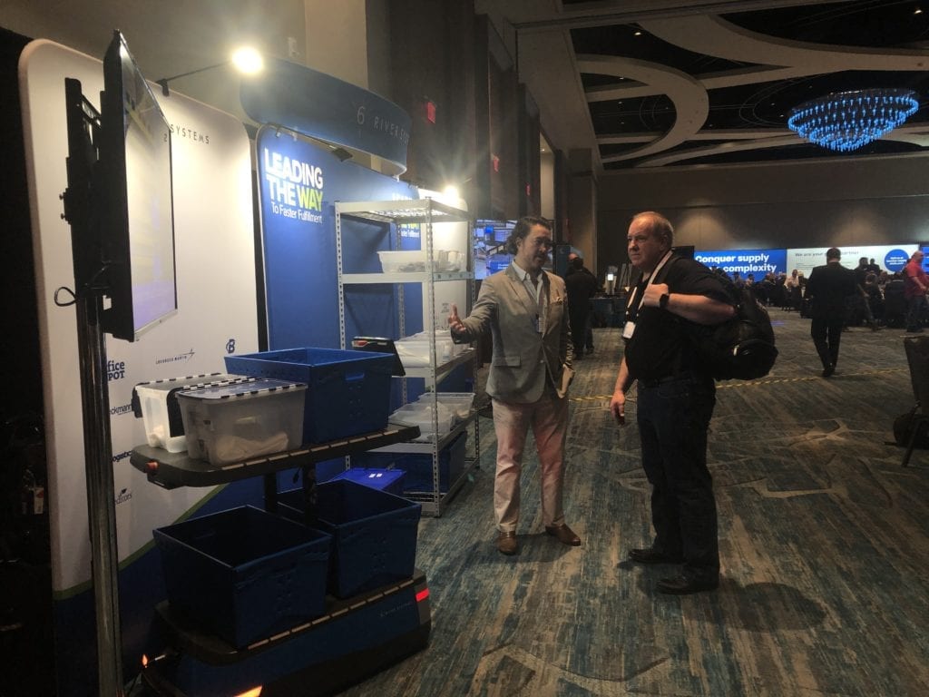 An Elevate attendee speaks with 6 River Systems about their autonomous mobile robots.