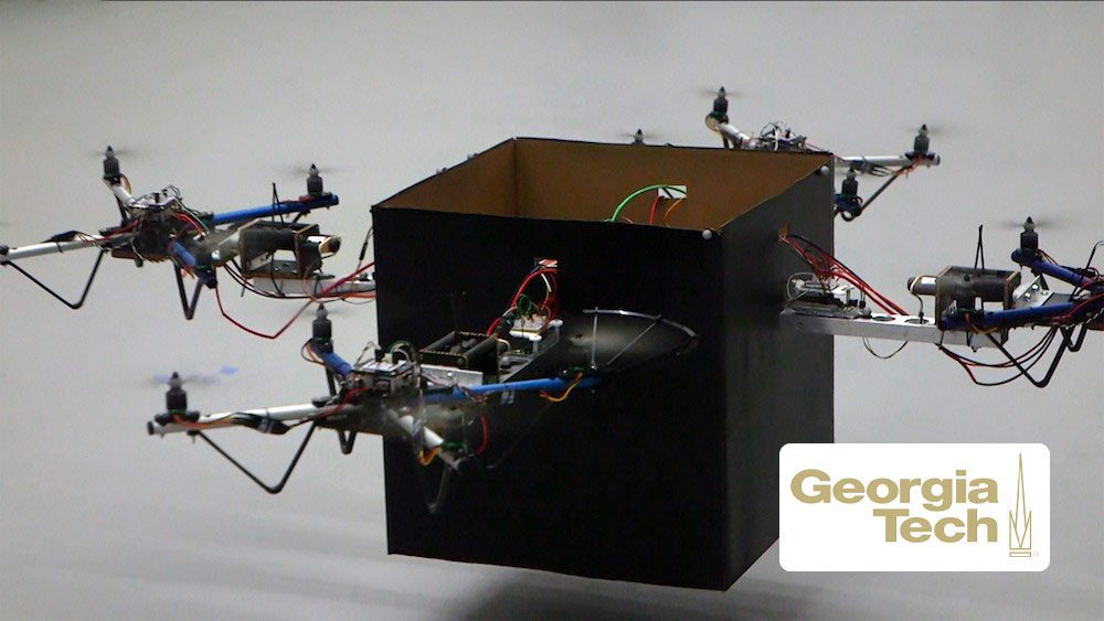 Drones team up to carry heavy packages