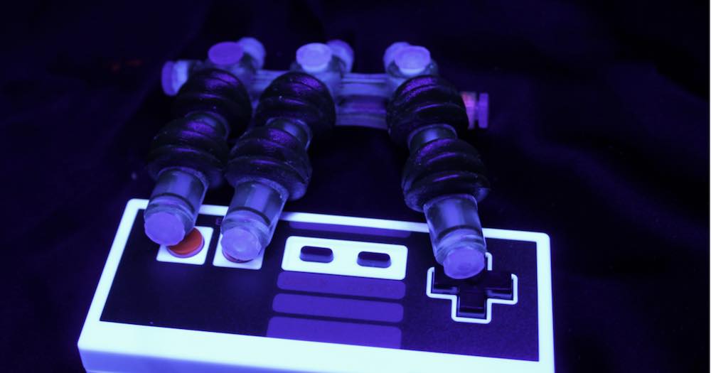 Watch a soft robotic hand play Super Mario Bros.