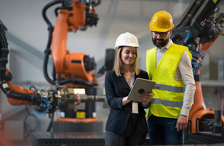 robotics engineers in front of robot